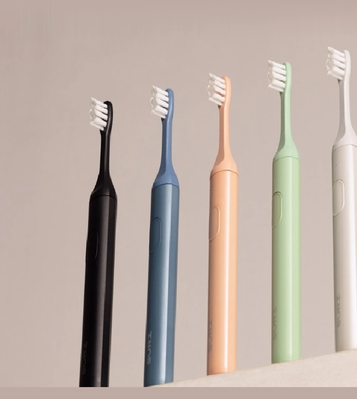 SURI sustainable sonic electric toothbrushes in studio setup representing responsible brand growth